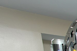 a home gym with exercise equipment and windows